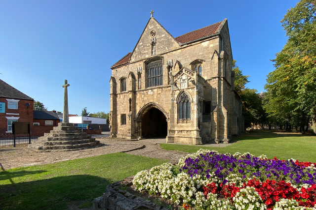 Worksop Priory Gatehouse and relocated marketplace cross